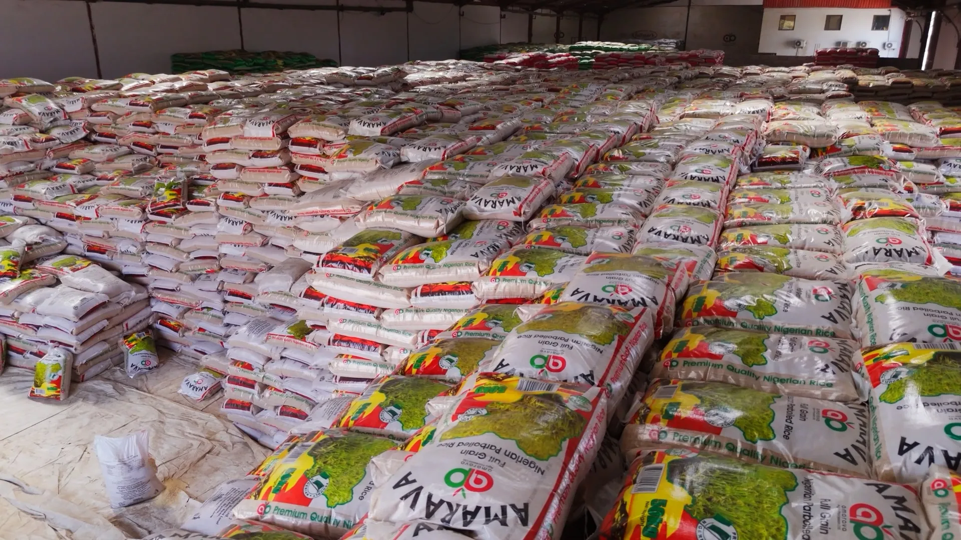 Perfectly arranged stacks of premium parboiled rice bags in storage
